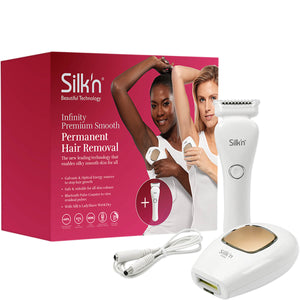 Unboxed Silk'n Infinity Premium Smooth 500k device with Silk'n Wet & Dry LadyShave Shaver and cable in front of the Silk'n Infinity Premium Smooth 500k device packaging